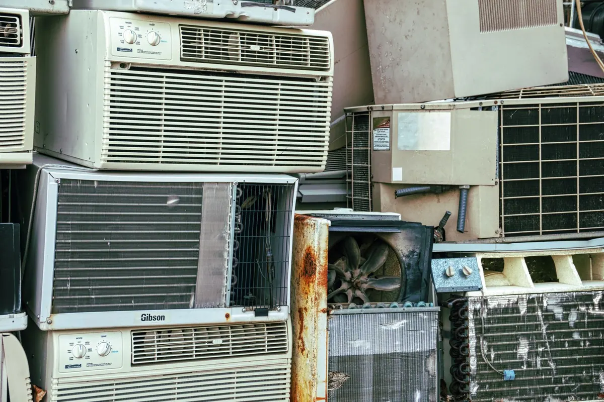 Stack of old window air conditioning units