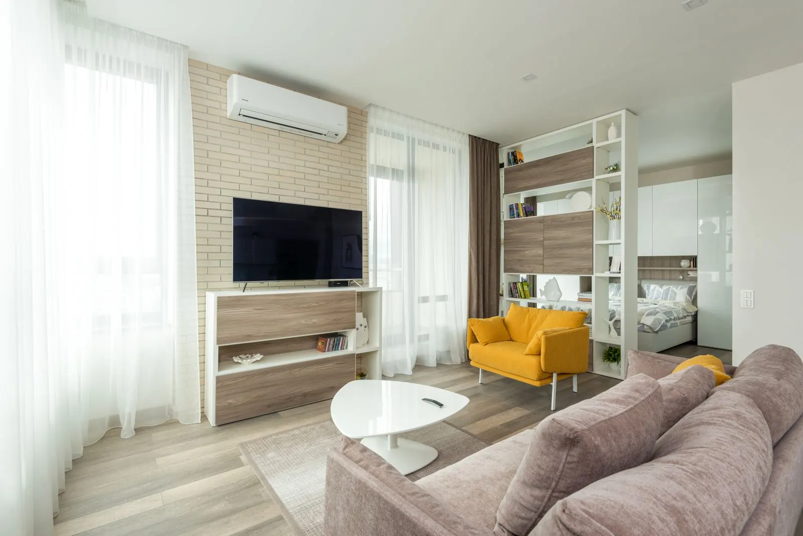 Bright living room with a wall-mounted air conditioner